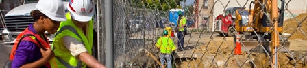 A construction site with workers in protective gear