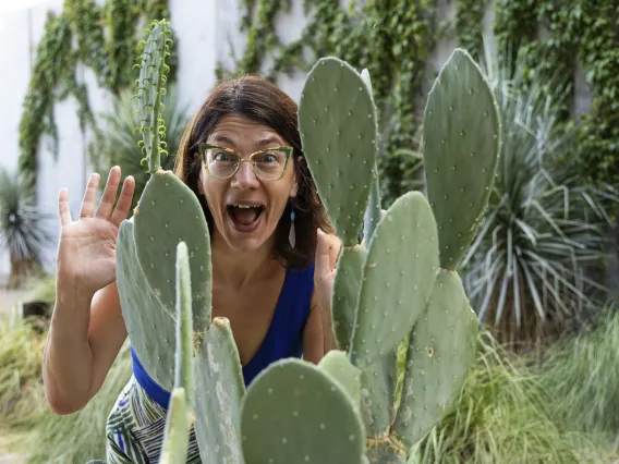 A headshot of Elise Gornish with a prickly pear cactus.