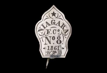 Small silver badge with a carved star and the text: "Niagra F. Co. No. 8 1861 W.P.P."