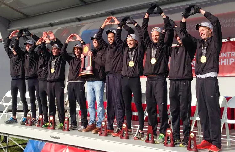 Members of the 2013 St. Olaf College men's cross country with the national championship trophy.