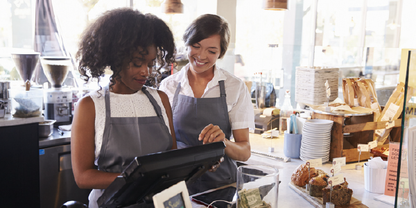 Two women at the cash register.