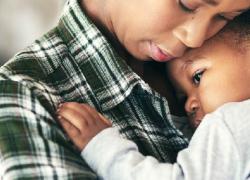 Woman holding a baby. 