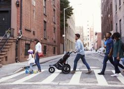 A group of pedestrians crossing the street. 