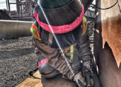 Photo of a woman working outdoors.