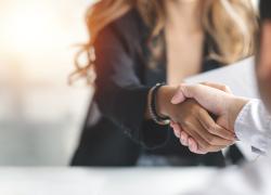 Businesswoman handshake with another professional.