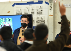 Thony Martino of Job Corps addresses Afghan evacuees at Holloman Air Force Base.