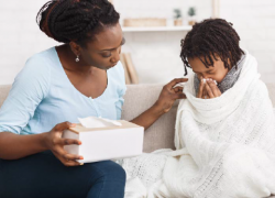 A mother caring for her sick child. 