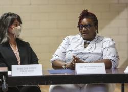 Wendy Chun-Hoon listens to Kimber Washington speak at a roundtable in Alabama.