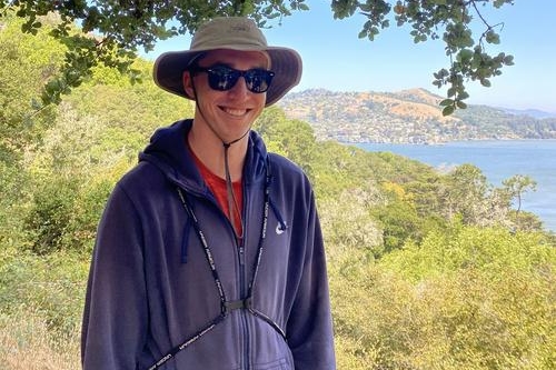 A picture of UC Berkeley student Samuel Bobick behind landscape (Photo Credit: Data 8).