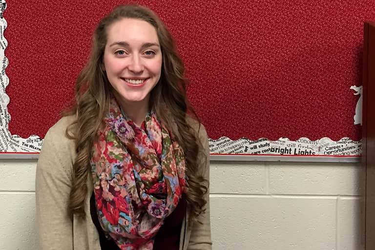 Carly McGuire standing in the hallways at Swartz Creek Community school.