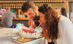 Two people sharing ice cream sundae at The Place 2 Be