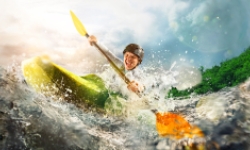 Woman kayaking on river