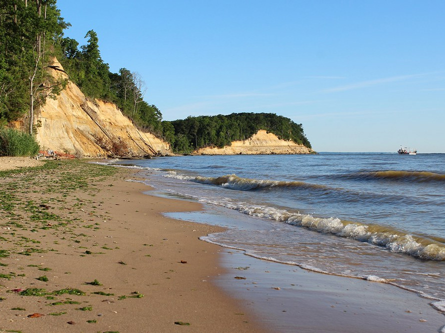 View of the sheer cliffs from the beach, they're hundreds of feet tall