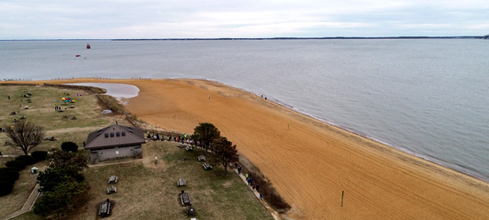 Drone view the beach with the Bay Bridge in the background