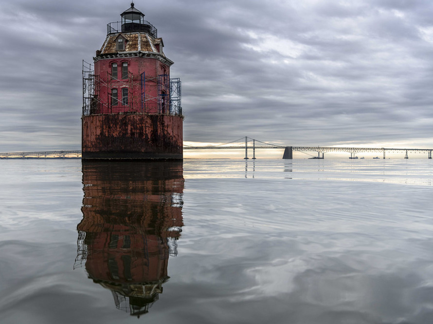 Lighthouse off Sandy Point with Bay Bridge in the background