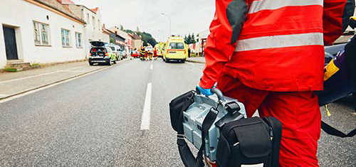 First responder walking down a street