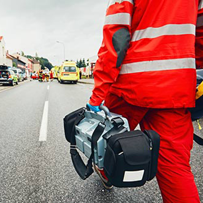 First responder walking down a street