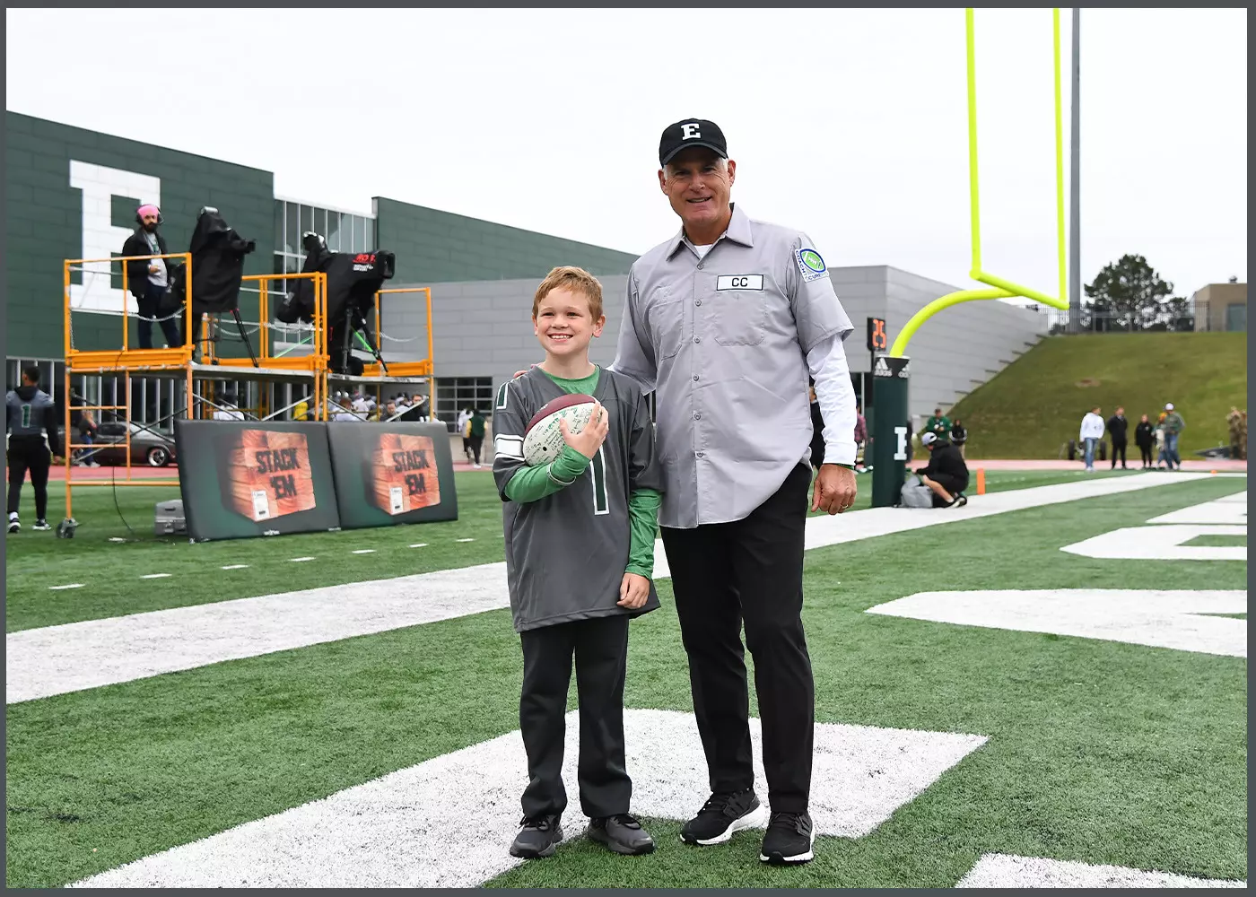 Kid On Field with Coach Creighton