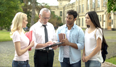 A group of students at a university with a professor