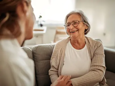 Female doctor consulting her senior patient