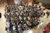 The large international student class poses for a group photo.