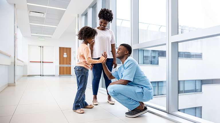 Pediatrician and Family with Child.