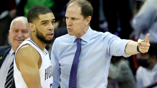 Terrell Brown Jr. #23 and head coach Mike Hopkins of the Washington Huskies talk during the first half against the Arizona State Sun Devils at Alaska Airlines Arena on February 10, 2022 in Seattle, Washington. (Photo by Steph Chambers/Getty Images)