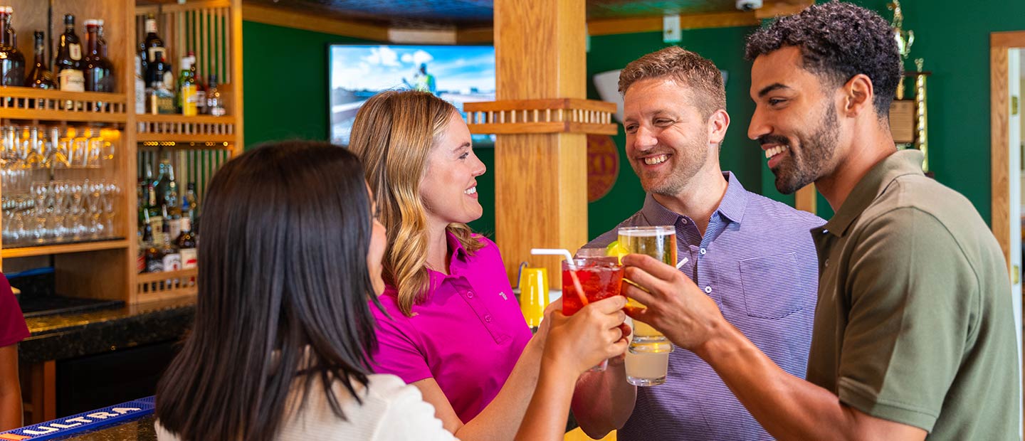 People enjoying cocktails at the bar