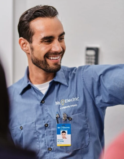 Smiling Mr. Electric electrician.