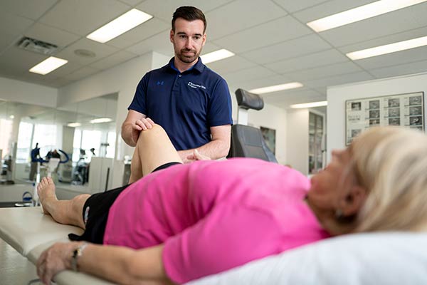 Caregiver working on a patient's leg.