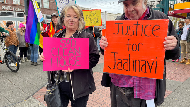 A photo showing people protesting the Seattle Police Officer's Guild (SPOG) and its Vice President, Det. Daniel Auderer, after his comments allegedly mocking Jaahnavi Kandula's death in January. (KOMO)