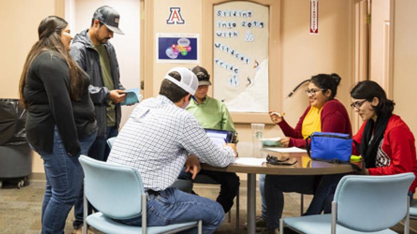 Group of Student talking at a table