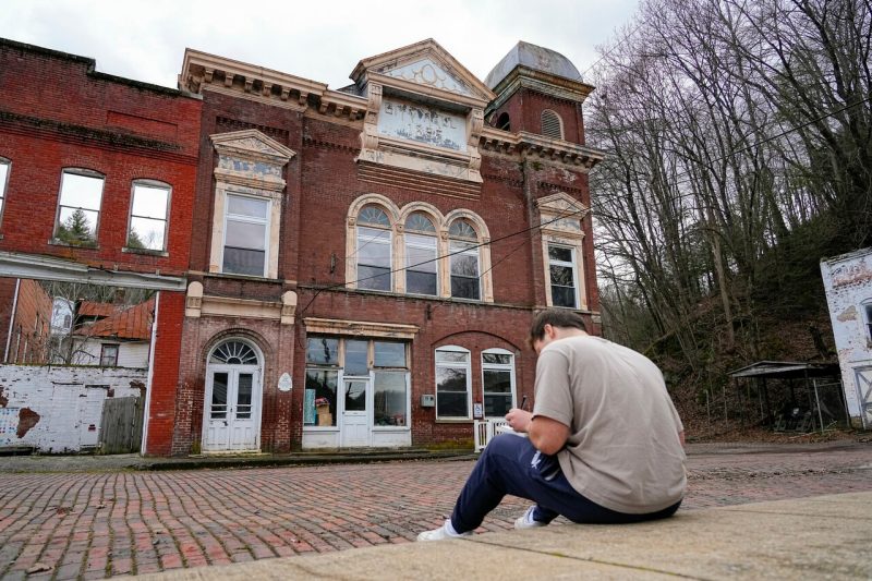 student sketching old building