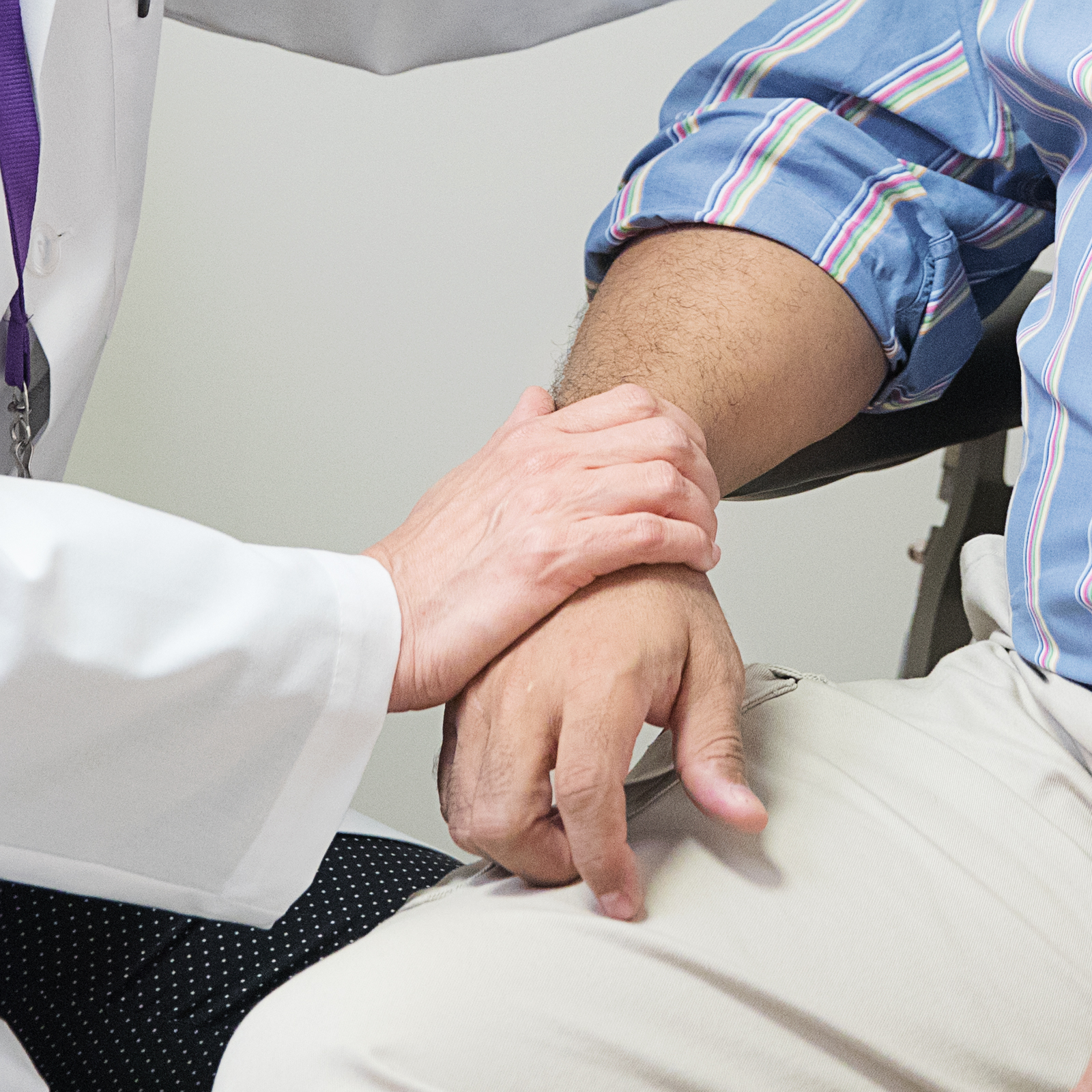 Doctor Touching Patient's Hand