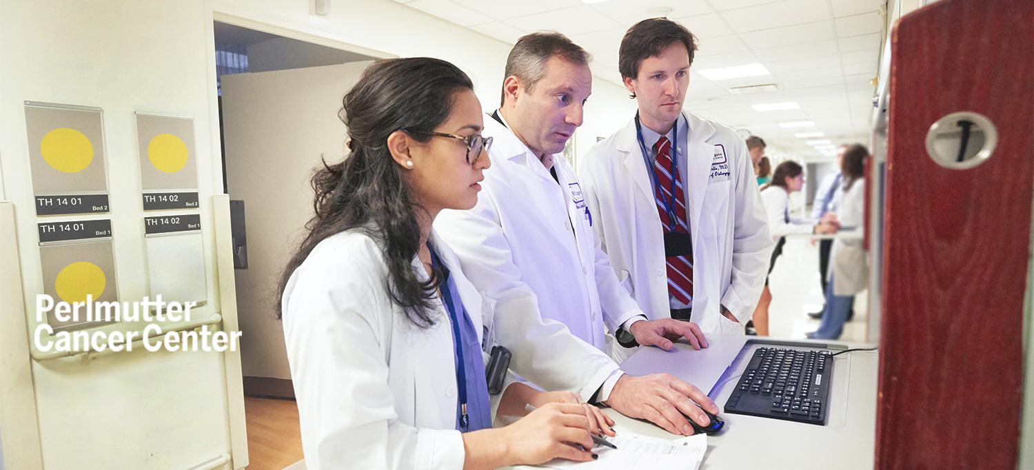 Dr. Adam S. Jacobson with Resident and Fellow at Computer Station