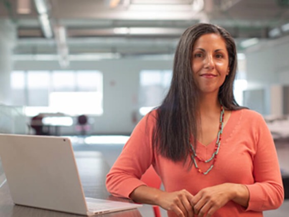 Woman in office looking happy