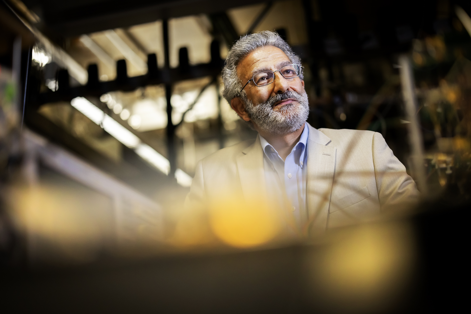 nader engheta in his lab with equipment in foreground