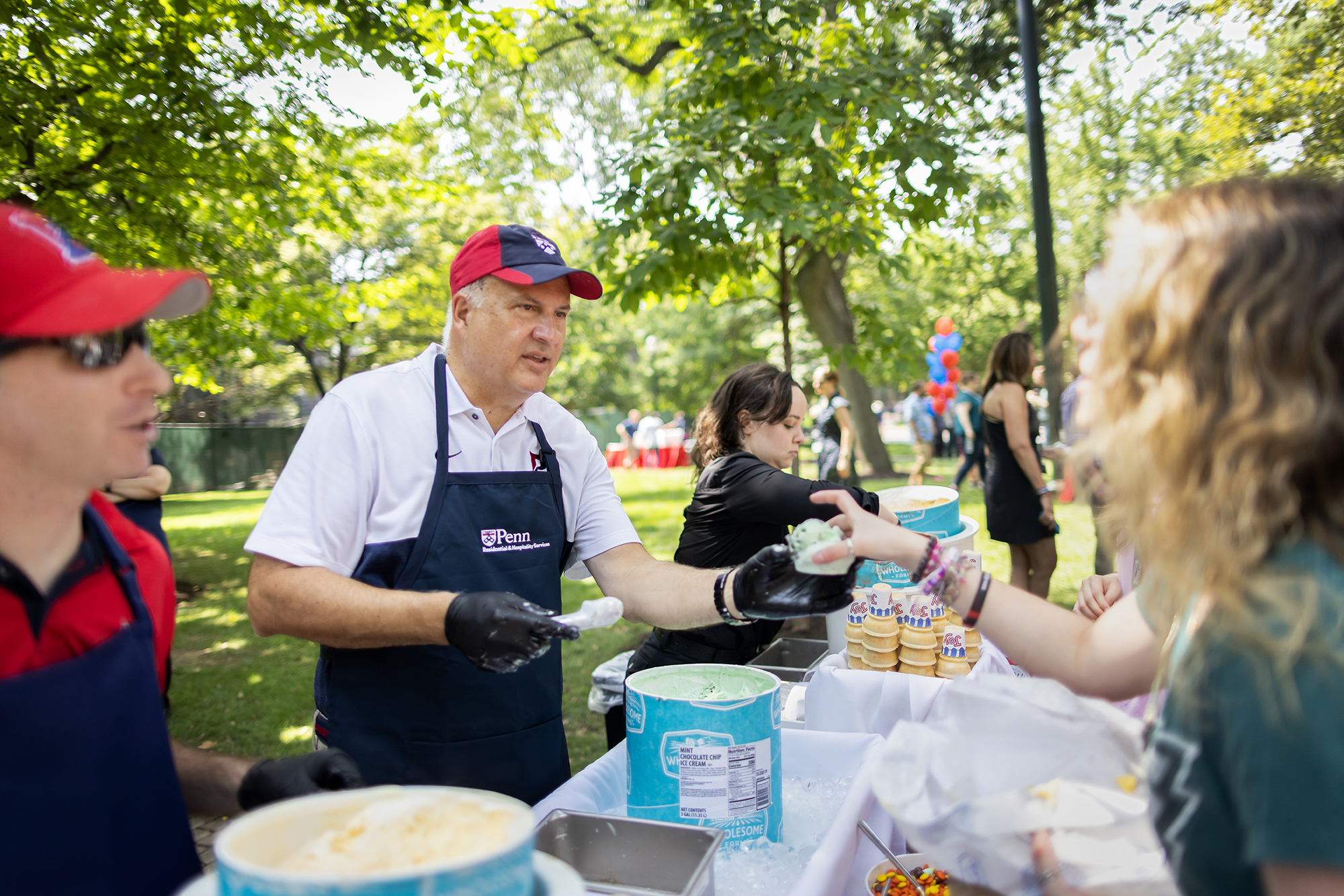 Craig Carnaroli scoops ice cream on College Green.