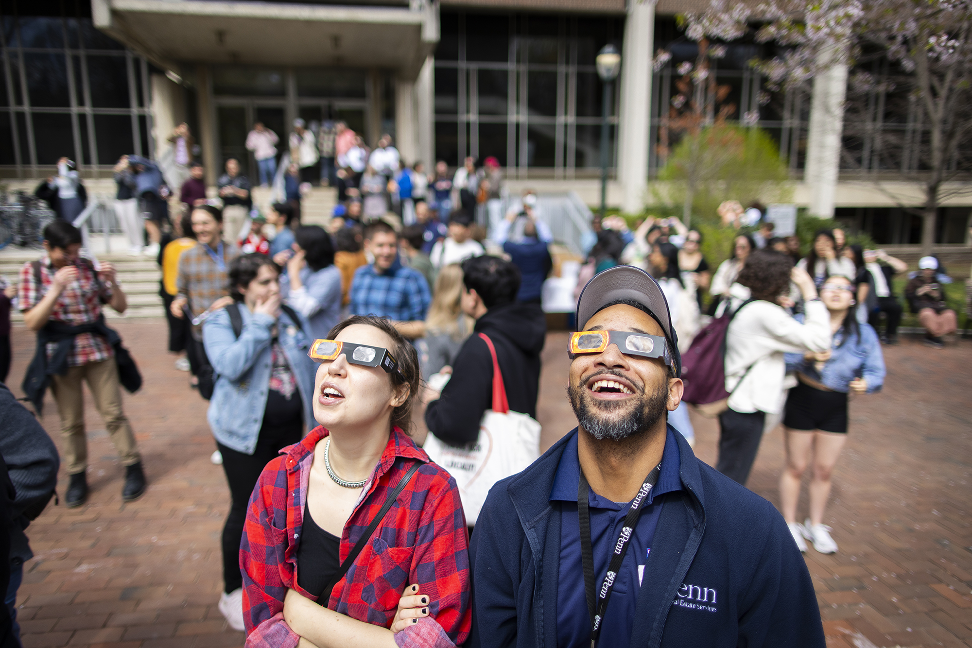 two people looking up at the sky with sunglasses on