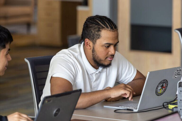 High school senior Robert King uses a laptop at the Stevens Center.