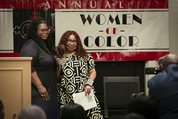 Valerie Dorsey-Allen poses with Colleen Winn, who holds her award