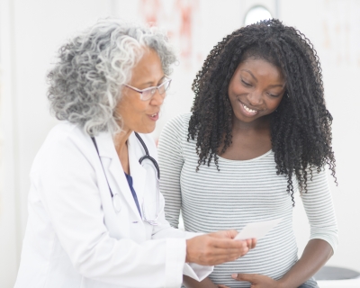 Pregnant woman with physician