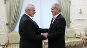 Ismail Haniyah (left), the political leader of Hamas, at a meeting with Iranian President Masoud Pezeshkian on 30 July 2024. 