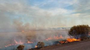 a fire burning on a clear day