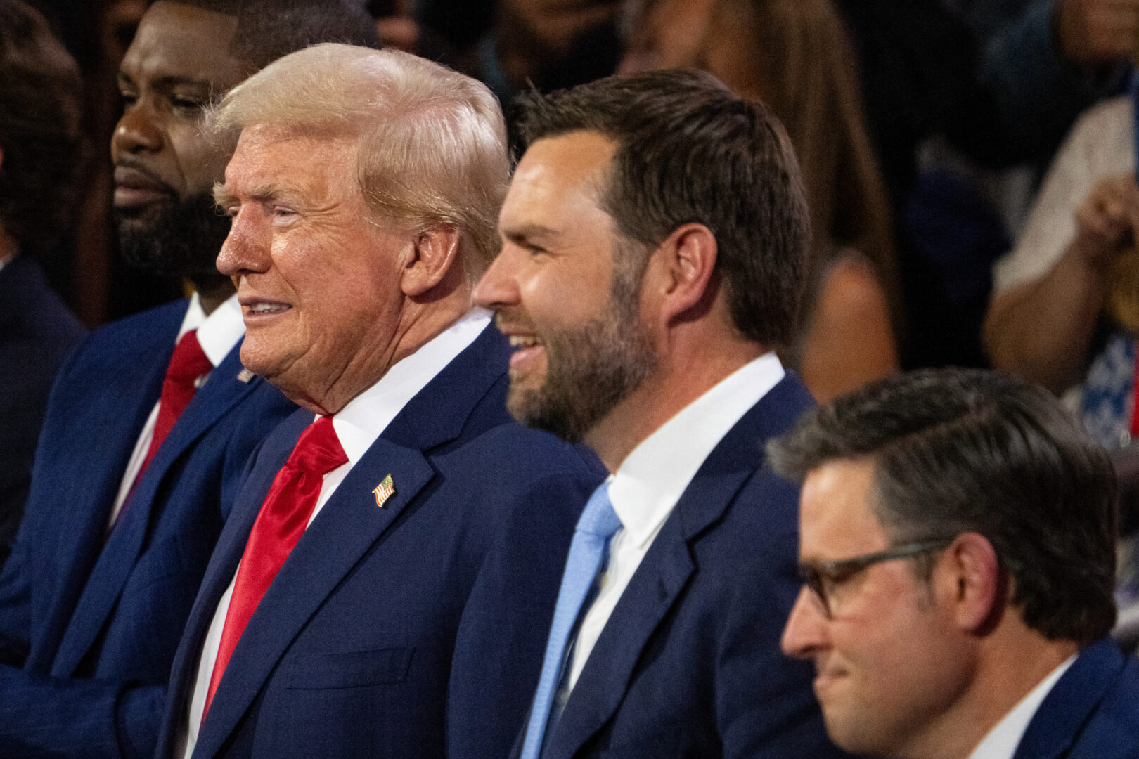 From left, Rep. Byron Donalds, R-Fla., former President Donald Trump, vice presidential nominee Sen. J.D. Vance, R-Ohio, and Speaker of the House Mike Johnson, R-La., sit together at the Republican National Convention in Milwaukee on Monday.