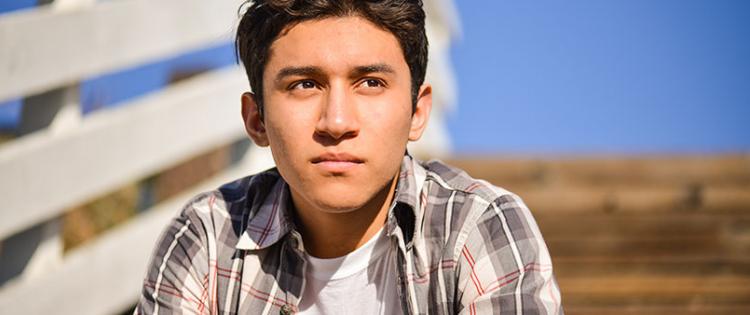 young man staring into distance