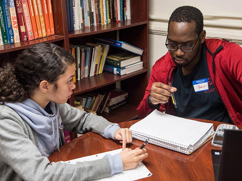 Two students studying together at desk