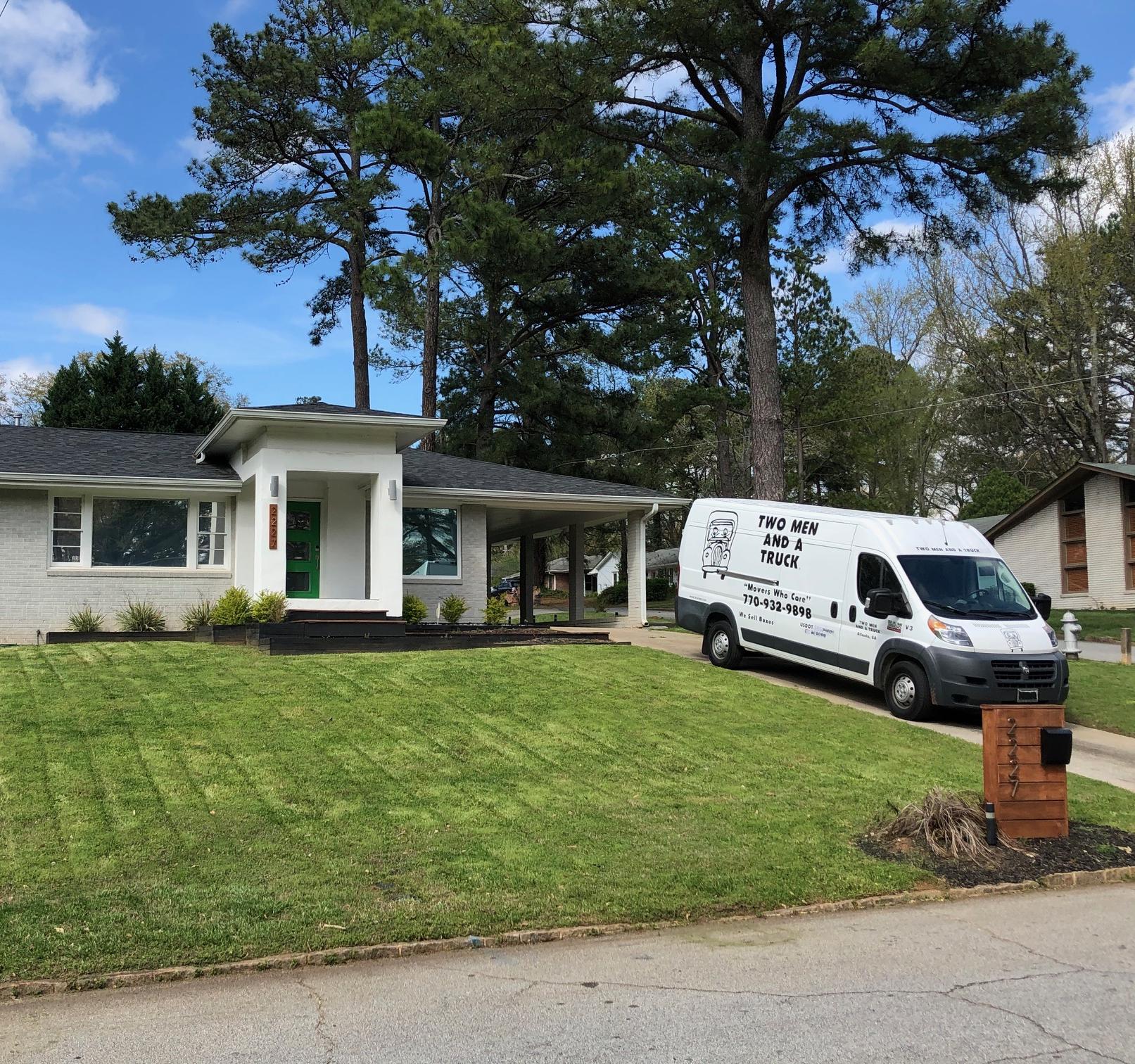 delivery truck parked in front of a home