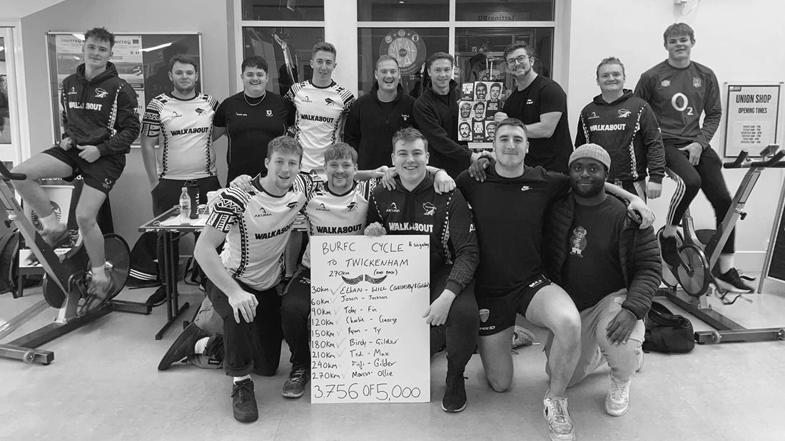 Group of Movember ambassadors posing for camera after a cycle fundraiser event