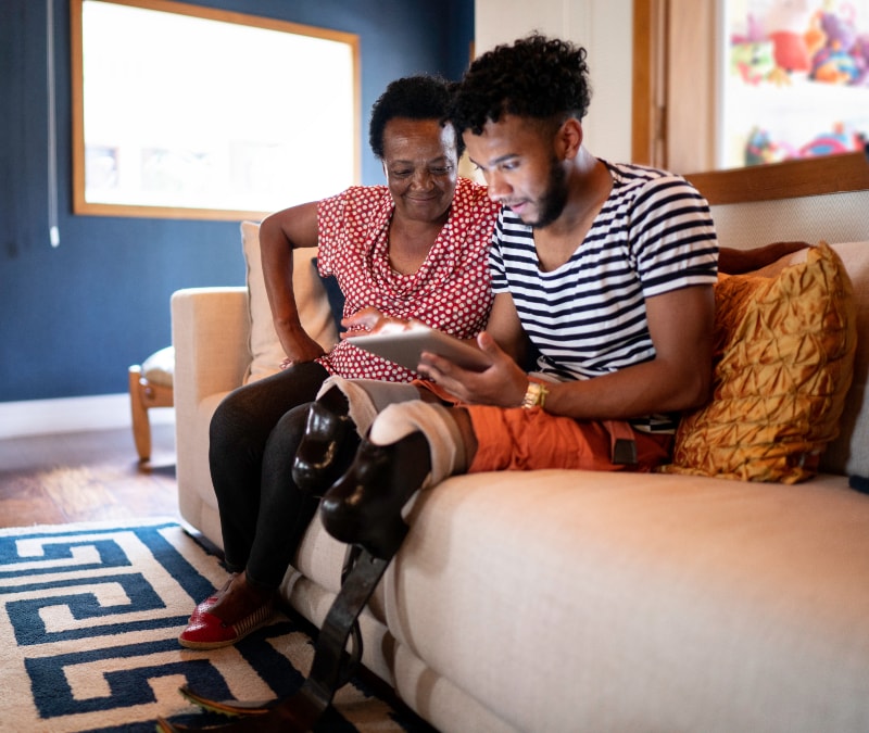 A son checking if his mother received a scam e-card.